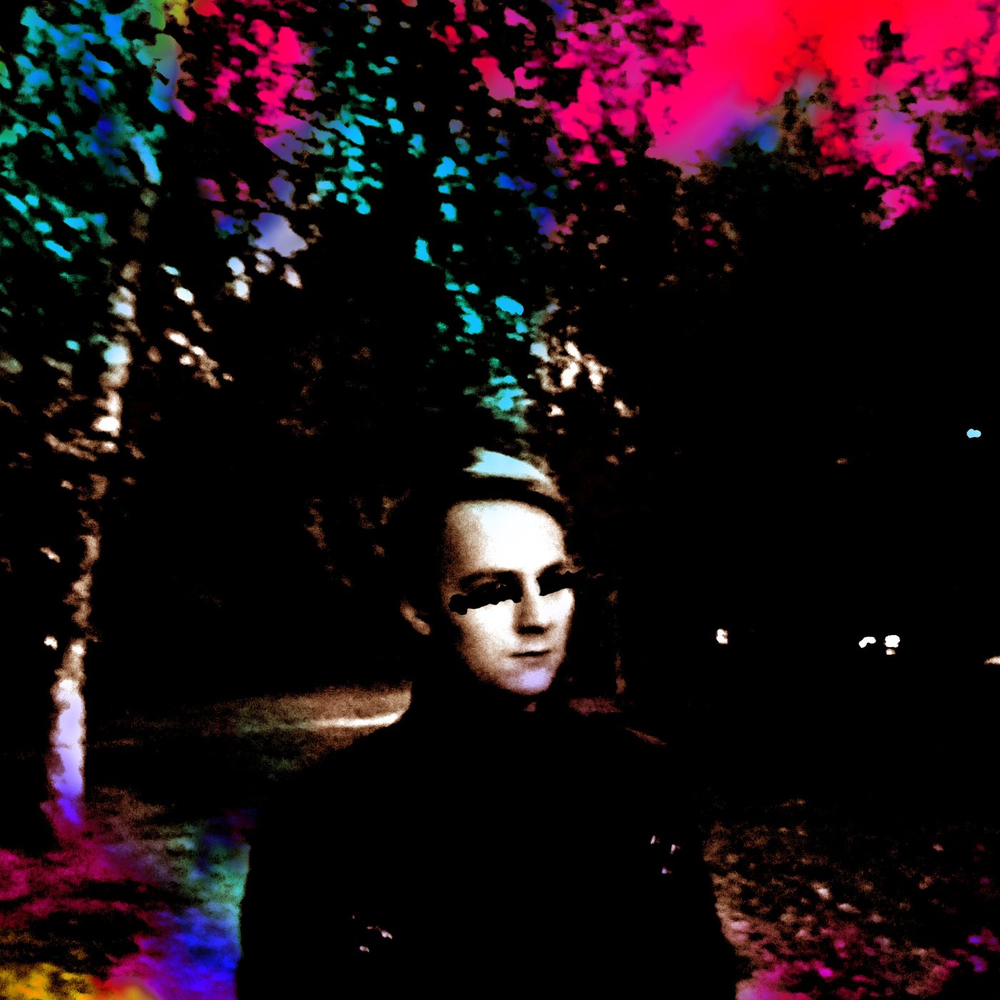 High-contrast portrait under trees lit in neon pink, cyan, and green